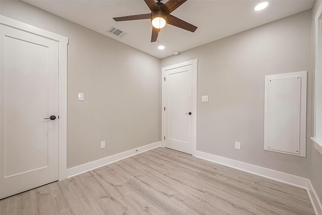 spare room featuring ceiling fan and light wood-type flooring