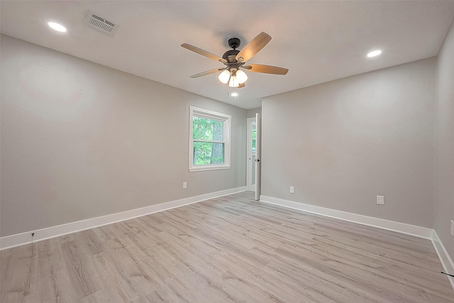 empty room featuring ceiling fan and light hardwood / wood-style floors