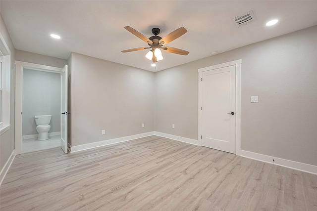 spare room with ceiling fan and light hardwood / wood-style flooring