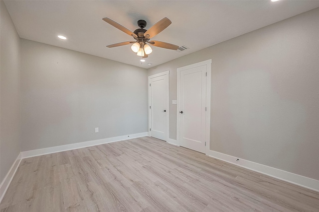 unfurnished bedroom with ceiling fan and light wood-type flooring