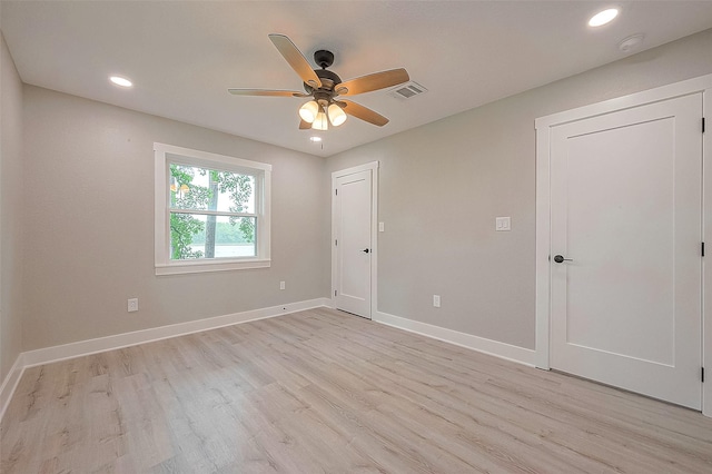 unfurnished room with ceiling fan and light hardwood / wood-style flooring