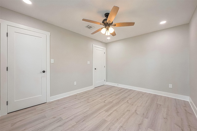 unfurnished room featuring ceiling fan and light wood-type flooring