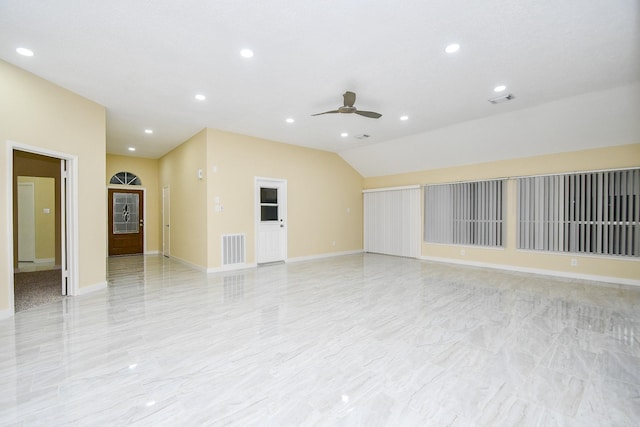 empty room featuring vaulted ceiling and ceiling fan