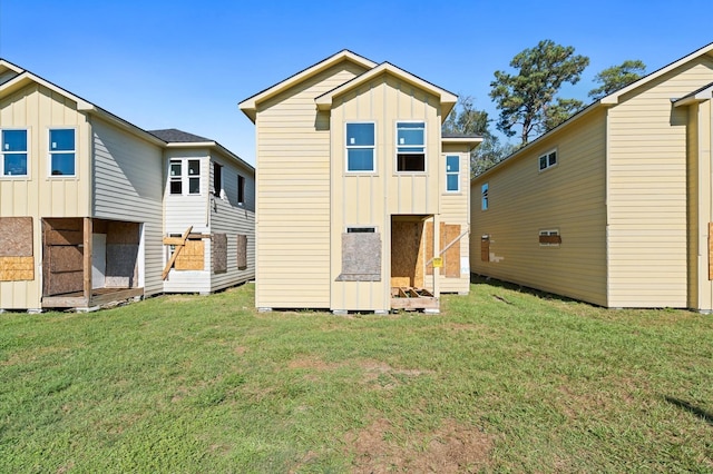 rear view of house with a lawn