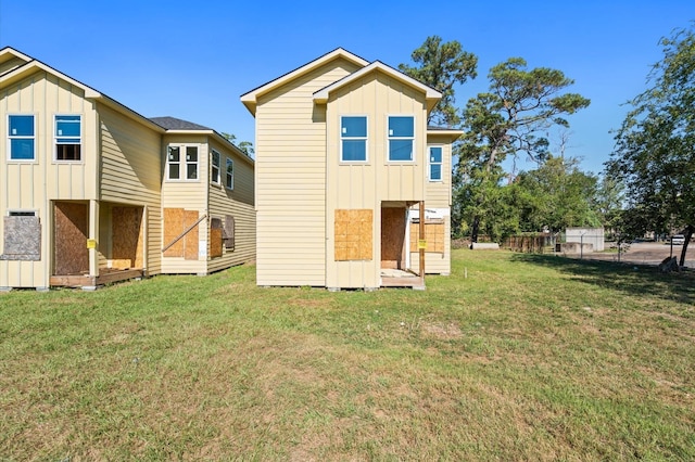 back of house with a yard