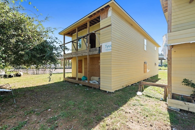 view of property exterior with a yard