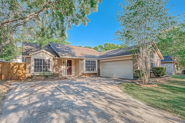 ranch-style house with a garage and a front lawn