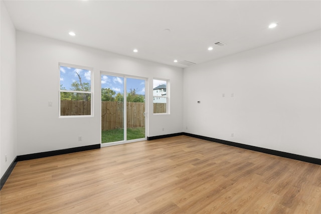 spare room featuring light hardwood / wood-style flooring