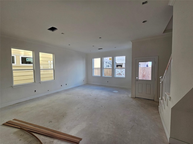 entrance foyer featuring crown molding