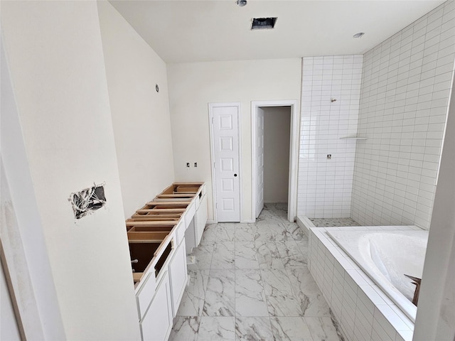 bathroom featuring vanity and separate shower and tub