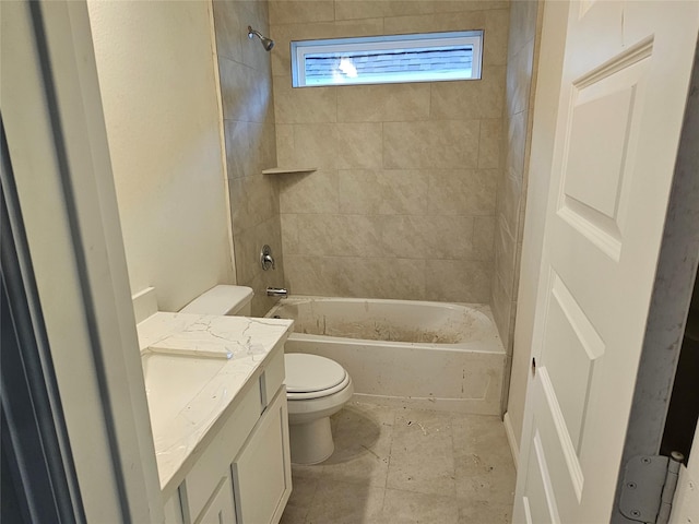 full bathroom with vanity, toilet, and tiled shower / bath