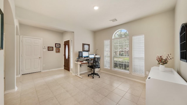 home office with light tile patterned floors