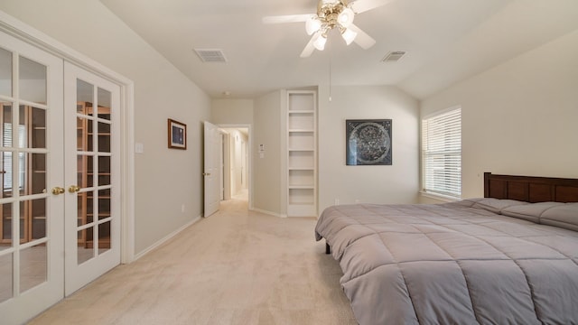 bedroom featuring ceiling fan, french doors, light carpet, and lofted ceiling