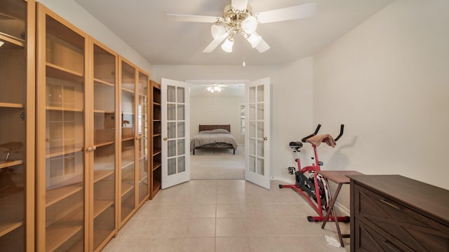 hall featuring french doors and light tile patterned floors