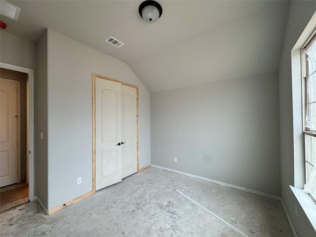 additional living space featuring lofted ceiling