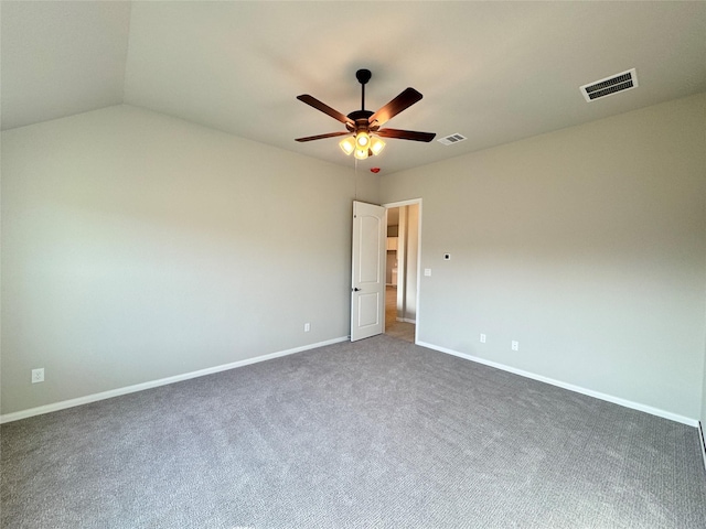 empty room featuring dark carpet and ceiling fan