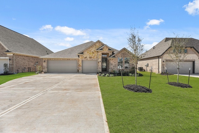 view of front of property with brick siding, an attached garage, stone siding, driveway, and a front lawn