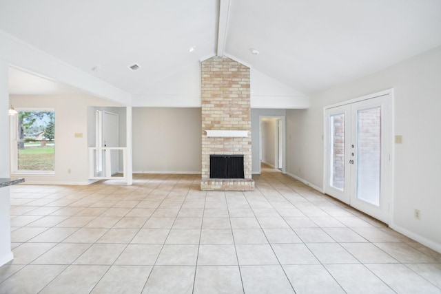 unfurnished living room featuring french doors, vaulted ceiling with beams, a brick fireplace, and light tile patterned floors