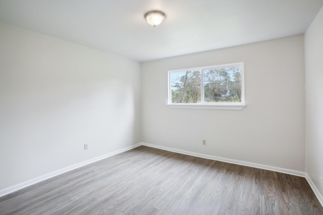 empty room featuring wood-type flooring