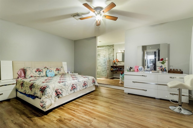 bedroom with ceiling fan and wood-type flooring