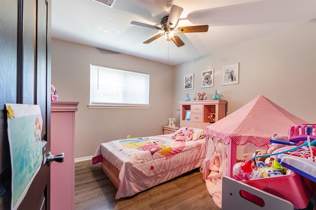 bedroom with hardwood / wood-style flooring and ceiling fan