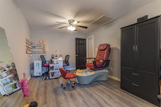 office featuring hardwood / wood-style flooring and ceiling fan