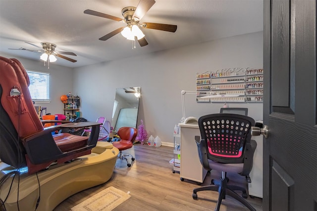 office area with ceiling fan and light hardwood / wood-style floors