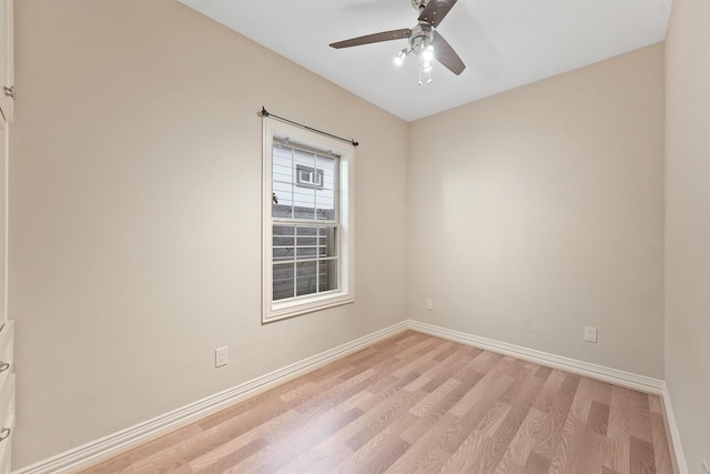 spare room featuring light wood-type flooring and ceiling fan