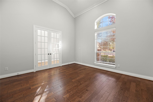 empty room with french doors, dark hardwood / wood-style floors, and plenty of natural light