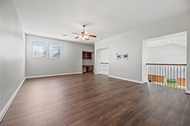 unfurnished living room with dark hardwood / wood-style floors, ceiling fan, and lofted ceiling