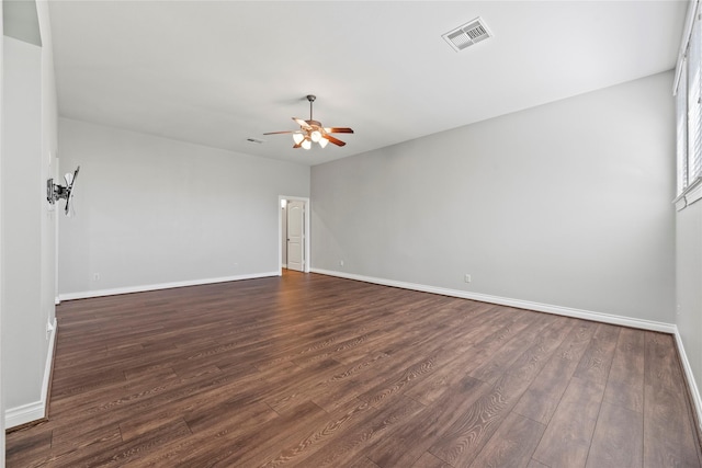 spare room featuring dark hardwood / wood-style floors and ceiling fan