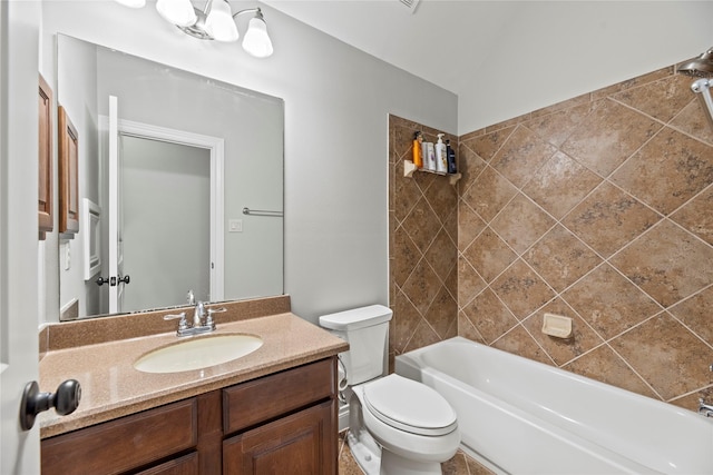 full bathroom with vanity, toilet, tiled shower / bath, and lofted ceiling