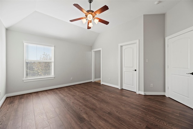 unfurnished bedroom featuring ceiling fan, dark wood-type flooring, and vaulted ceiling