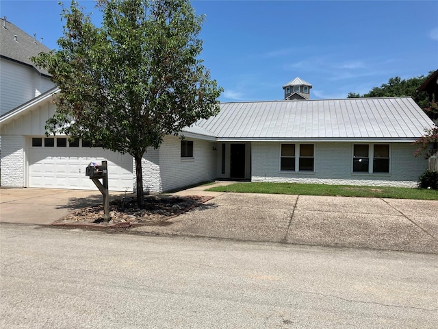 single story home with a garage