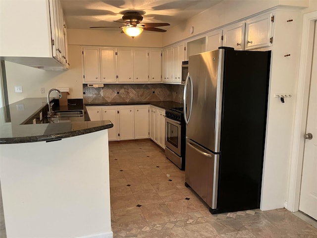 kitchen with white cabinetry, appliances with stainless steel finishes, sink, and kitchen peninsula