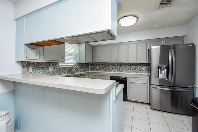 kitchen featuring dishwasher, sink, stainless steel refrigerator with ice dispenser, gray cabinets, and kitchen peninsula