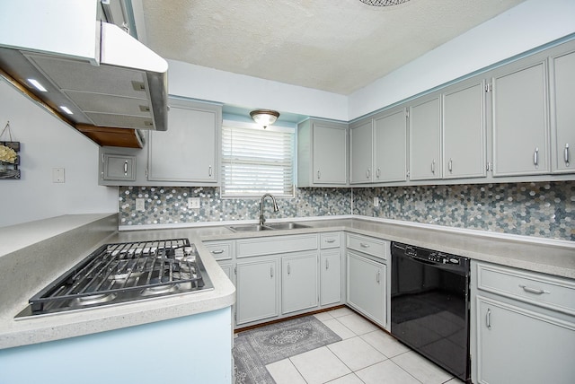 kitchen with dishwasher, sink, stainless steel gas stovetop, decorative backsplash, and light tile patterned flooring