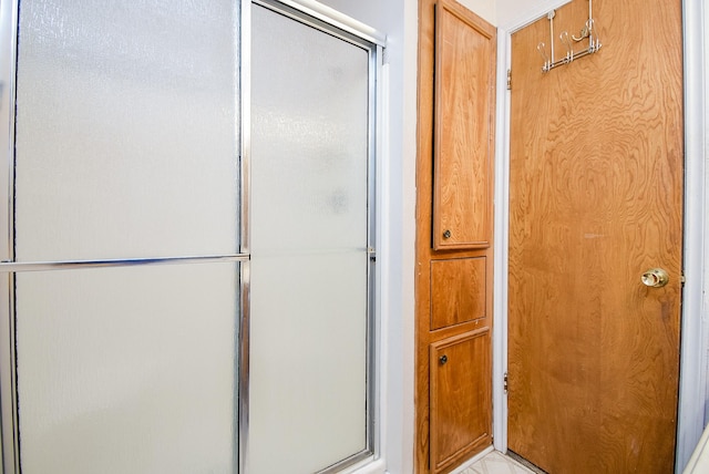 bathroom with an enclosed shower