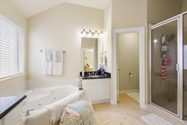 bathroom featuring vanity, tile patterned floors, a wealth of natural light, and lofted ceiling