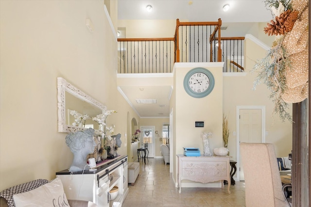 foyer entrance featuring a towering ceiling