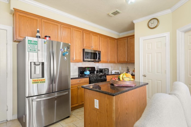 kitchen featuring decorative backsplash, ornamental molding, stainless steel appliances, light tile patterned floors, and a center island