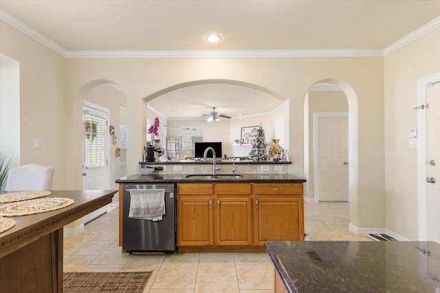 kitchen with ceiling fan, dishwasher, sink, dark stone countertops, and ornamental molding