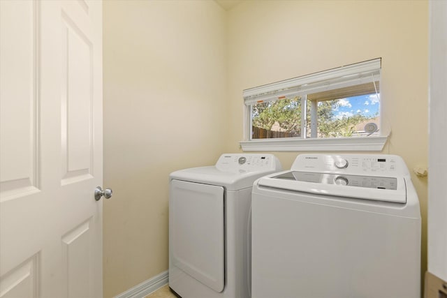 laundry room with washing machine and clothes dryer