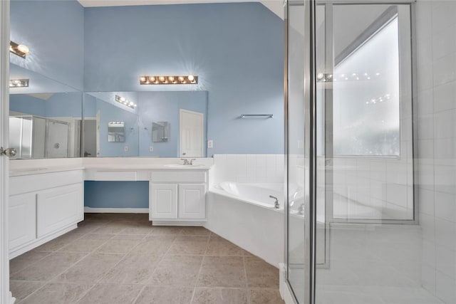 bathroom featuring tile patterned flooring, vanity, and shower with separate bathtub