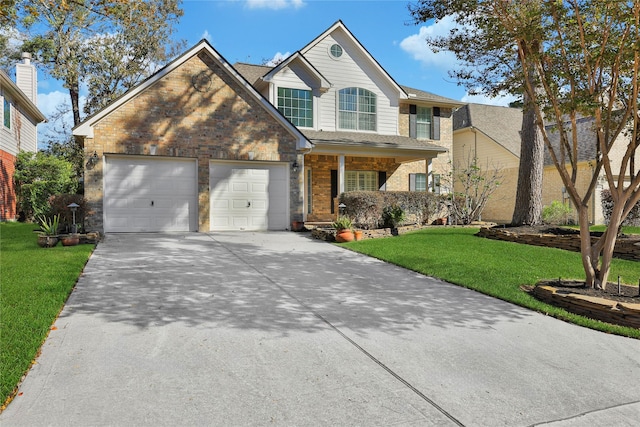 view of front of property with a front yard and a garage