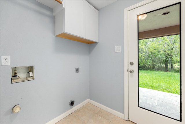 laundry room with washer hookup, electric dryer hookup, light tile patterned flooring, and cabinets