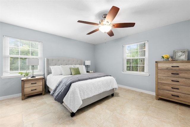 bedroom featuring ceiling fan and light tile patterned floors