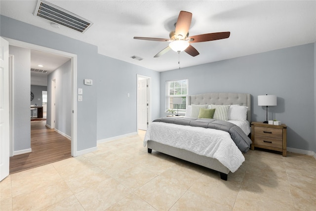 tiled bedroom with ceiling fan