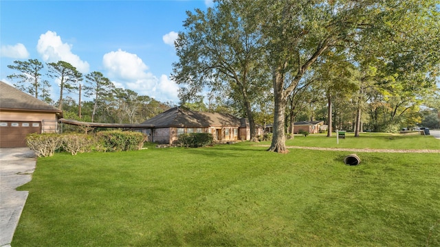 view of yard with a garage