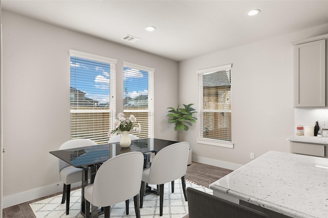 dining area featuring hardwood / wood-style floors